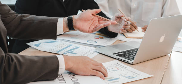 istock The Asian business team brainstormed and discussed work planning. Financial or statistical figures of the company in the conference room 2004850288