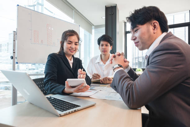 istock The Asian business team brainstormed and discussed work planning. Financial or statistical figures of the company in the conference room 2004853017