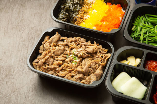 istock stir-fried meat and side dishes in a take-out container 2004864399