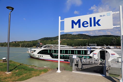 Danube river cruise ship stops in Melk in Wachau region of Austria.