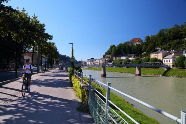 Cyclists ride the Tauern Radweg long distance bicycle route in Salzburg, Austria.