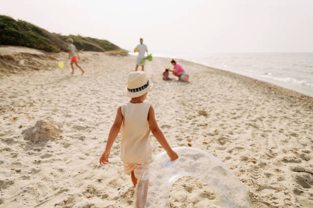 istock Young boy on the beach vacation 2004910924