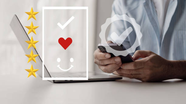 istock Man uses mobile phone to check smiley faces and emoticons, customer service concept, customer service rating, photo concept of satisfaction survey and time, smile on face 2004938635