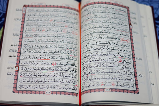 Quran, Al Qur'an, Islamic background for Eid al-Fitr Eid al-Adha. Open page of Al-Quran. Islamic concept
