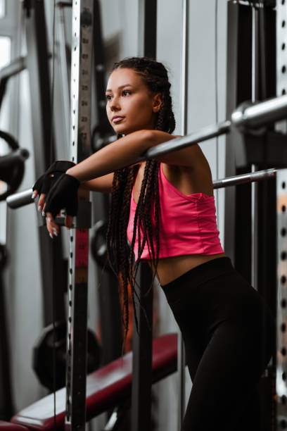 istock Athletic Female Leaning On Squat Bar While Preparing For Gym Workout 2004949533