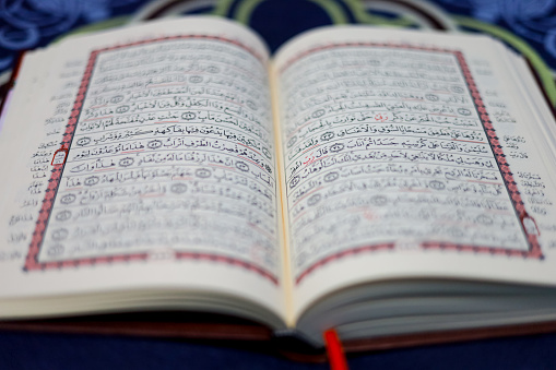 Quran, Al Qur'an, Islamic background for Eid al-Fitr Eid al-Adha. Open page of Al-Quran. Islamic concept