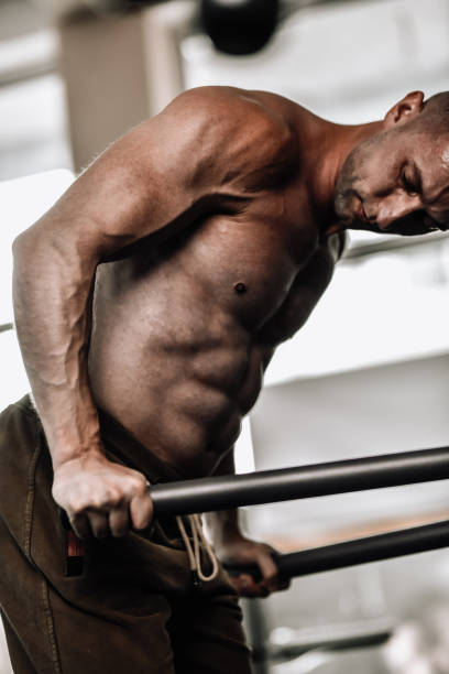 istock Athletic Male Concentrating On Dip Form While Working Out 2004954304