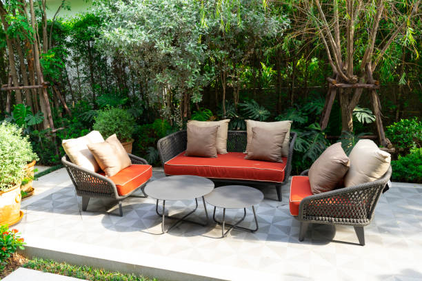 istock Backyard outdoor garden patio with modern wicker sofa and pillow. 2004955931