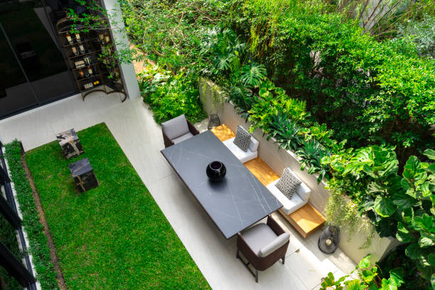 istock Backyard outdoor garden patio with modern wicker sofa and pillow. 2004964085