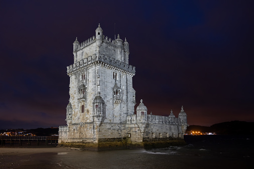 The Belem Tower on Tagus River at night in Lisbon, Portugal.