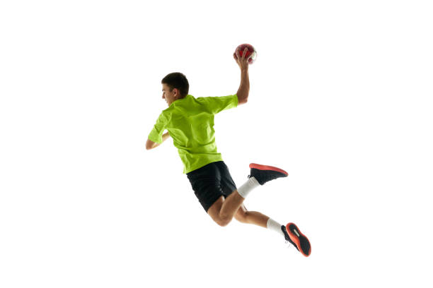 istock Competitive and concentrated young guy, handball player in motion during game, training against white studio background 2004978288