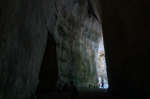 Syracuse, Italy-May 9, 2022:people visit Neapolis, the famous and vast natural park in Syracuse with an ancient Greek theatre, a church, caves and other remains from the Roman era.