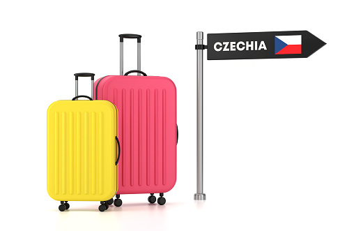 Yellow luggage with country stickers on white background