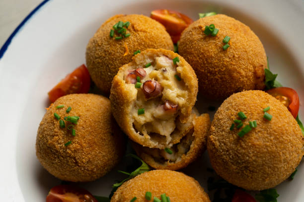 istock Spanish croquettes made with bechamel sauce and stuffed with octopus. Traditional tapa from northern Spain. 2005014533