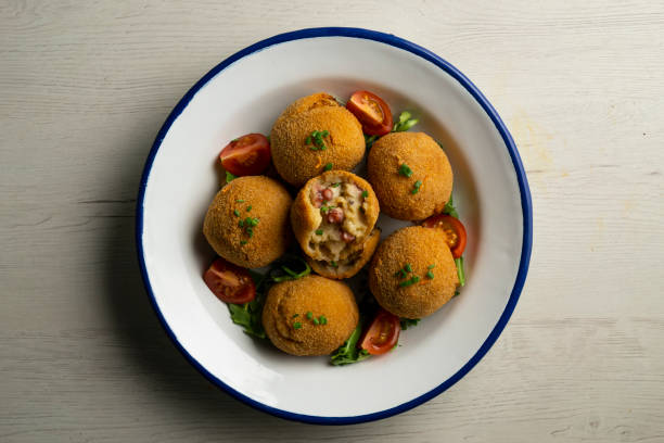 istock Spanish croquettes made with bechamel sauce and stuffed with octopus. Traditional tapa from northern Spain. 2005014548