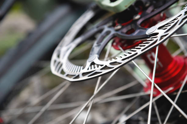 disc brakes on a bicycle wheel close-up. mountain bike detail close up stock photo