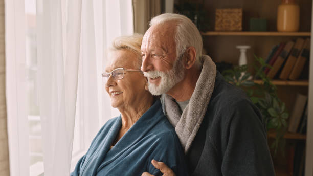 istock Embraced senior couple at home 2005015939