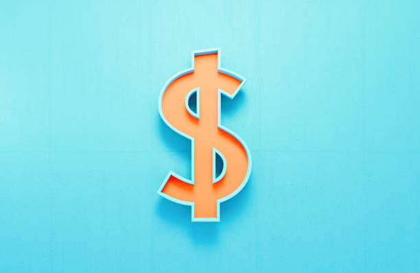 istock Orange Dollar Sign On Blue Concrete Wall Background 2005016068