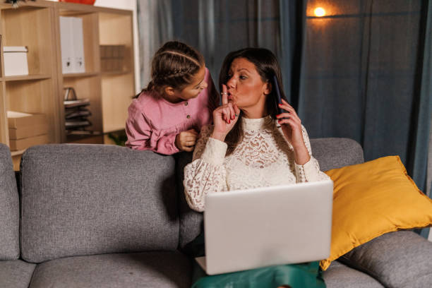 girl interrupting her mother while she is on a conference call - inconvenience meeting business distracted 뉴스 사진 이미지