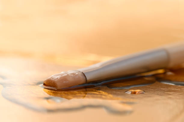 Cosmetic brush lying in serum, emulsion to moisturize the face