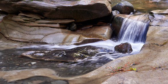 Closeup of a small stream running through the sculptured rocks at a local tourist attraction.