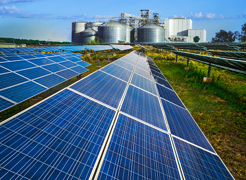 Industries embrace solar panels for cost-effective, sustainable energy, reducing environmental impact, green factory industry, renewable energy concept