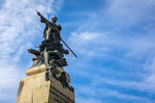 Segovia, Spain, 03.10.21. The Monument to Daoiz and Velarde by Aniceto Marinas, a memorial to two Spanish artillery officers who fell in Dos de Mayo Uprising, against blue sky.
