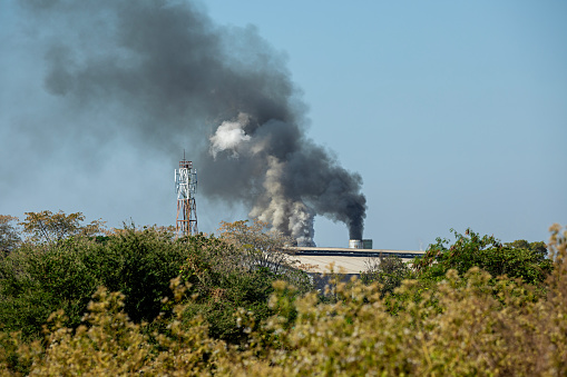 Aerial view of industrial factory. Structures of cement producing plant.