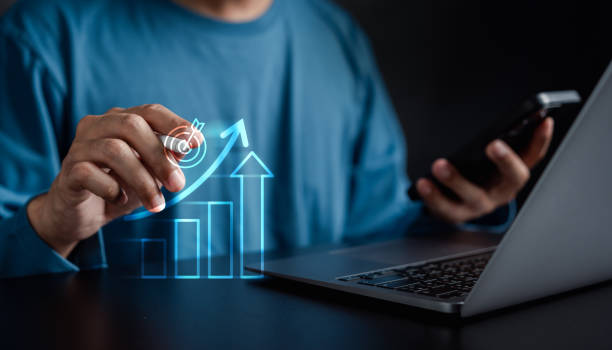 istock Business Chart Arrow Glowing on Stock market Analysis Data and Trading statistic value economic on hand index fund and money exchange business technology concept. 2005050937