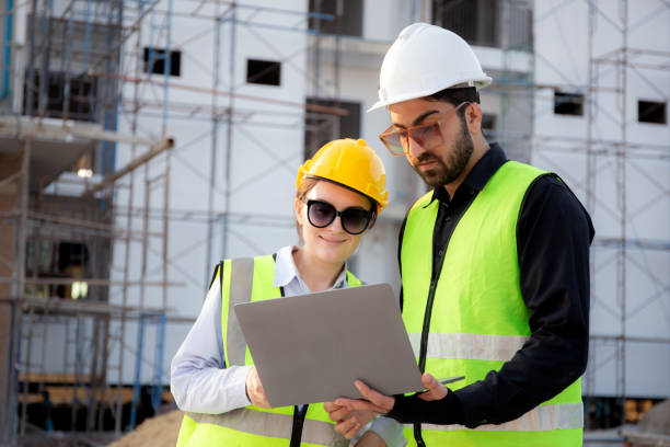 istock Team of architect or engineer looking laptop for inspection and planning construction at construction site, contractor or builder examining and checking project development house, industry concept. 2005053159