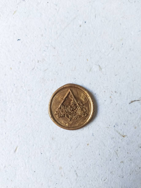 istock one vintage wax coin on a light background 2005077976