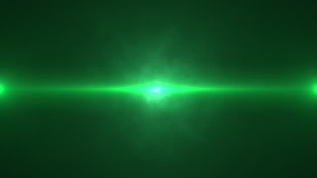 Cinematic green color optical flares and fog abstract background. Light effect for cinema science and technology background. Concept of celebration, fantasy, futuristic, space and astronomy.
