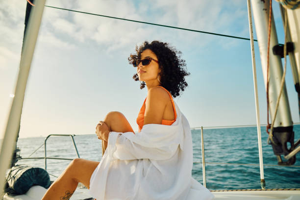istock Single Young Female Experiences Serene Travel at Sea 2005132550
