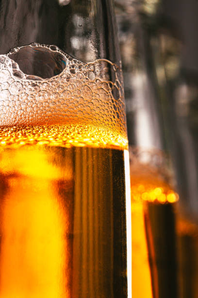 istock Bubbles in a bottle of lager beer macro close up 2005138998