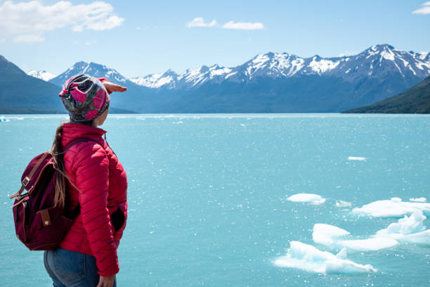 Tourist in Argentine Patagonia. Tourist looking towards the horizon in southern Argentina. Beautiful Argentine lake. Crystalline waters. glacier waters