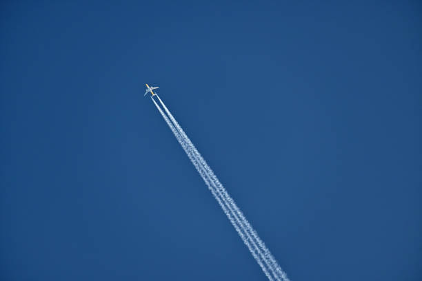 Airplane flies fast to make contrails in the sky