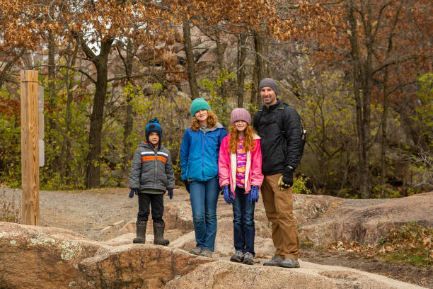 istock Family Exploring Old Granite Quarry Pond 2005199786