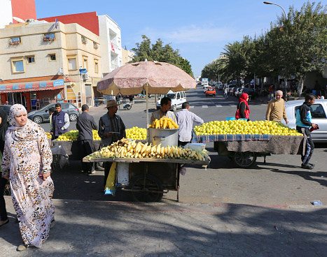 Agadir, Morocco-December 13,2015:Unidentified Fruit vendors and Customers at local  Souk Bazaar
