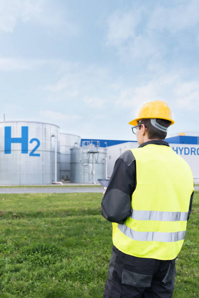 istock Engineer on a background of Hydrogen factory 2005204039