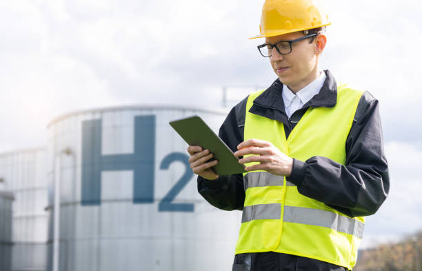istock Engineer on a background of Hydrogen factory 2005220355