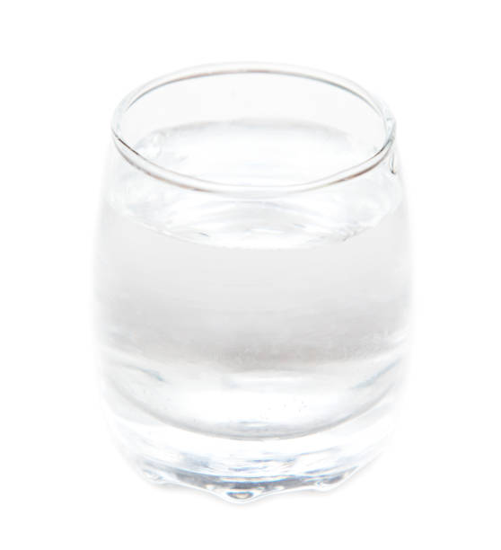 istock Shot glass with vodka isolated on white background. 2005226121