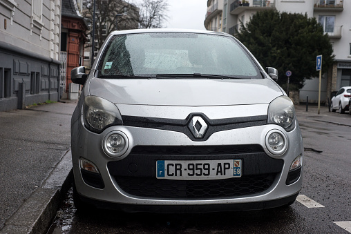Mulhouse - France - 11 february 2024 - Front view of grey Renault twingo 3 parked in the street by rainy day