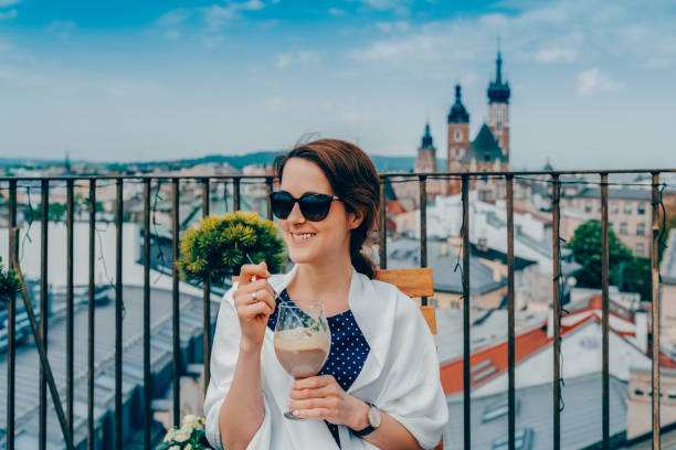 istock Woman in restaurant eating dessert 2005259985