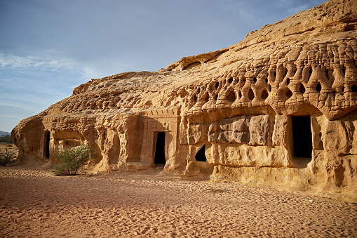 Entrances to burial sites in natural sandstone outcrops located in Al-Ula, Saudi Arabia.
