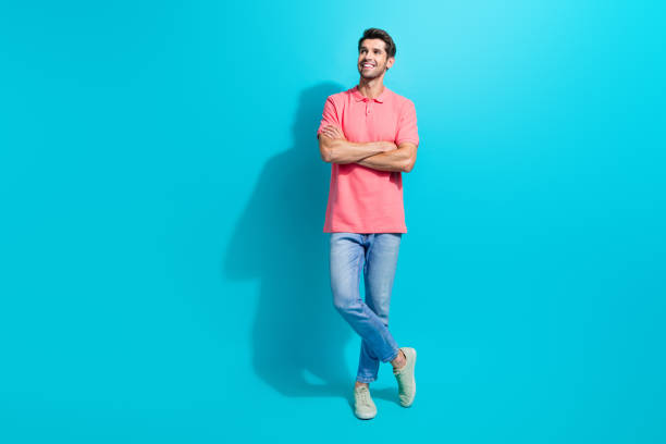 istock Full body length photo of young handsome model man folded arms looking empty space bright future isolated on aquamarine color background 2005354618