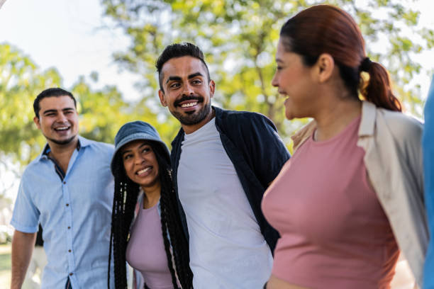 istock Friends talking on the public park 2005358381