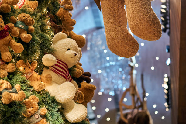 istock Christmas background with gift boxes under the Christmas tree and teddy bear decoration in rustic style interior 2005372295