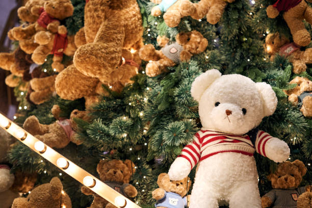 istock Christmas background with gift boxes under the Christmas tree and teddy bear decoration in rustic style interior 2005372296