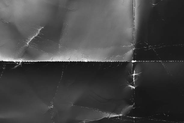 istock Wrinkled black old wrinkled paper. Dusty cardboard wrapping 2005373594