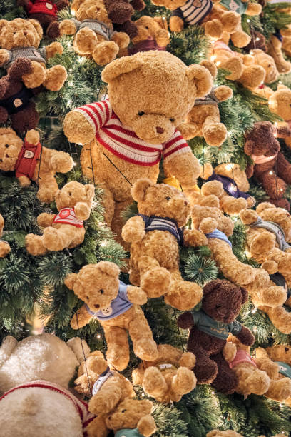 istock Christmas background with gift boxes under the Christmas tree and teddy bear decoration in rustic style interior 2005376566